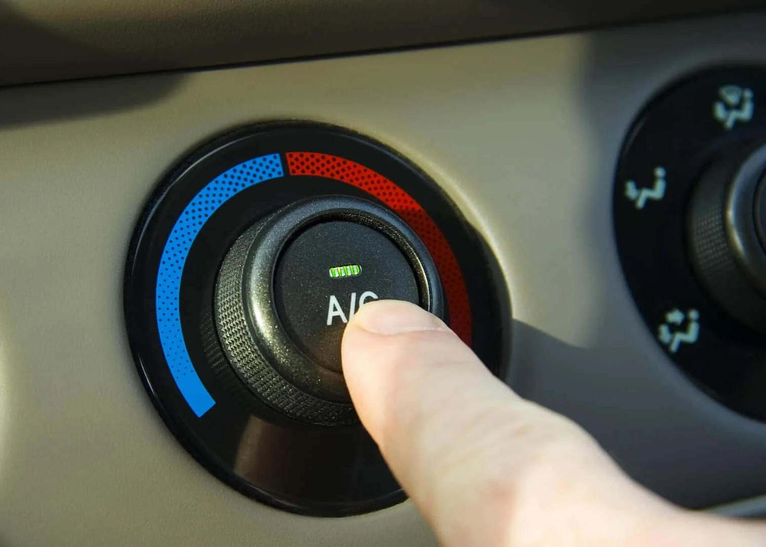 BMW technician inspecting an air conditioning system
